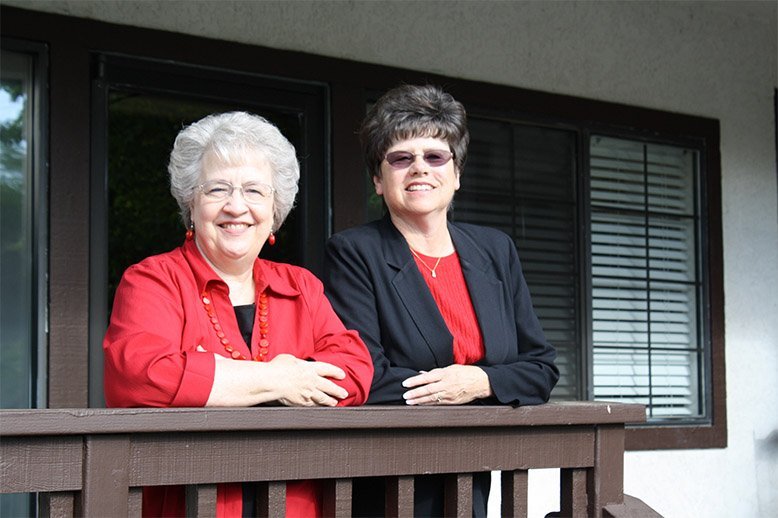Maryan and Patti, our chiropractic assistants, smiling on the porch of the office